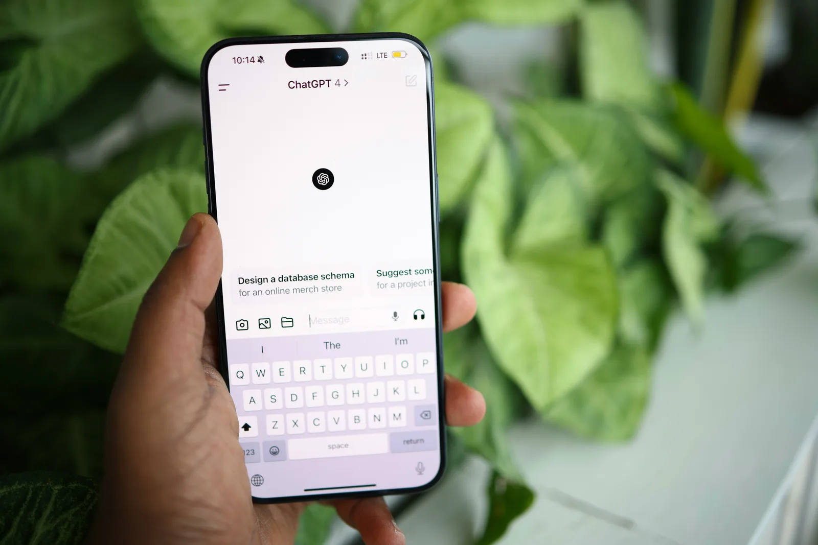 Hand holding a smartphone with the ChatGPT app open, symbolising how AI SEO consultants use generative engine optimisation to increase AI visibility across ChatGPT results and help brands recover traffic lost to AI.