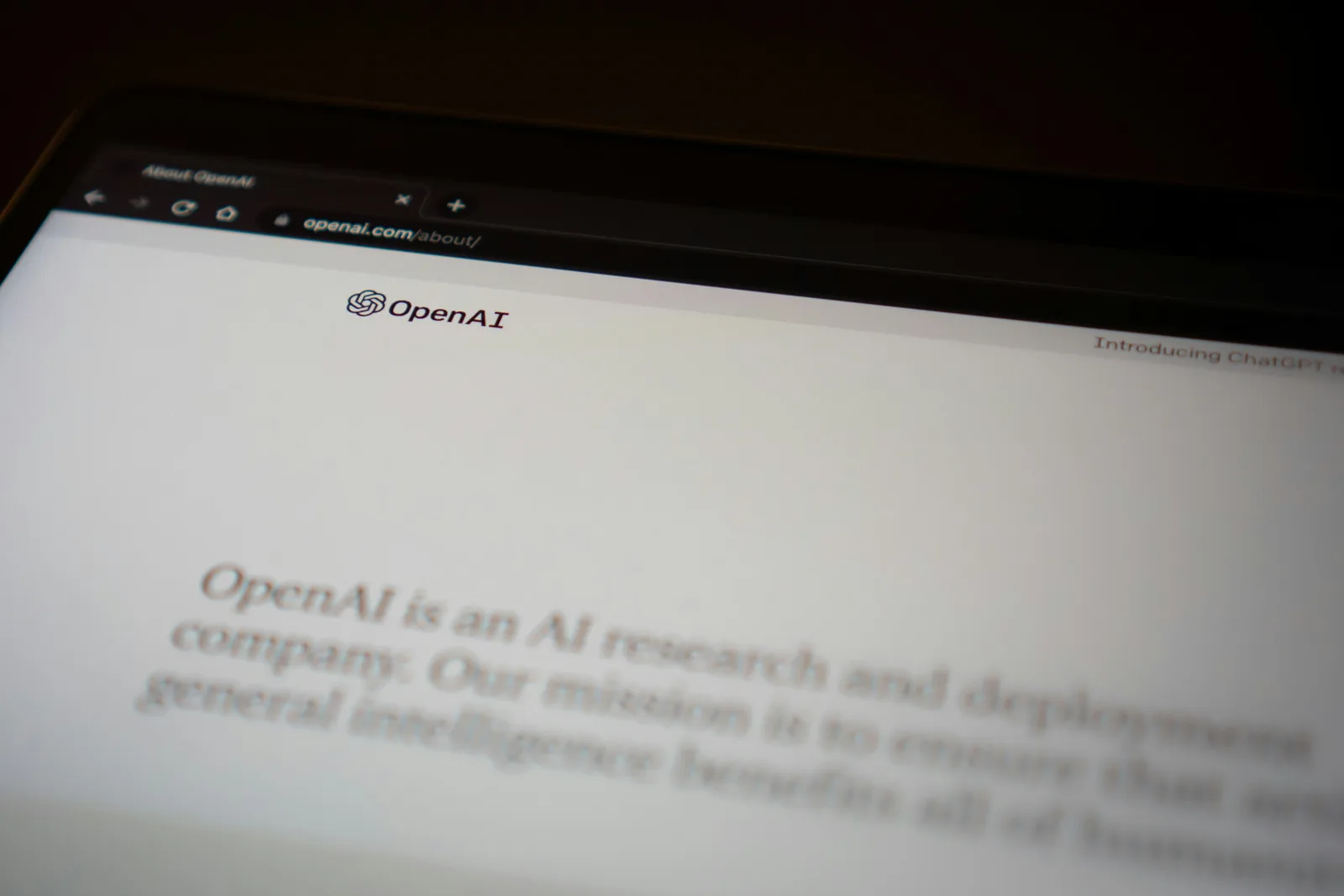 Laptop screen showing the OpenAI website, illustrating how OpenAI partnerships influence AI SEO optimisation, AI Visibility optimisation and help businesses improve AI visibility and Get Cited by ChatGPT in search-like responses.