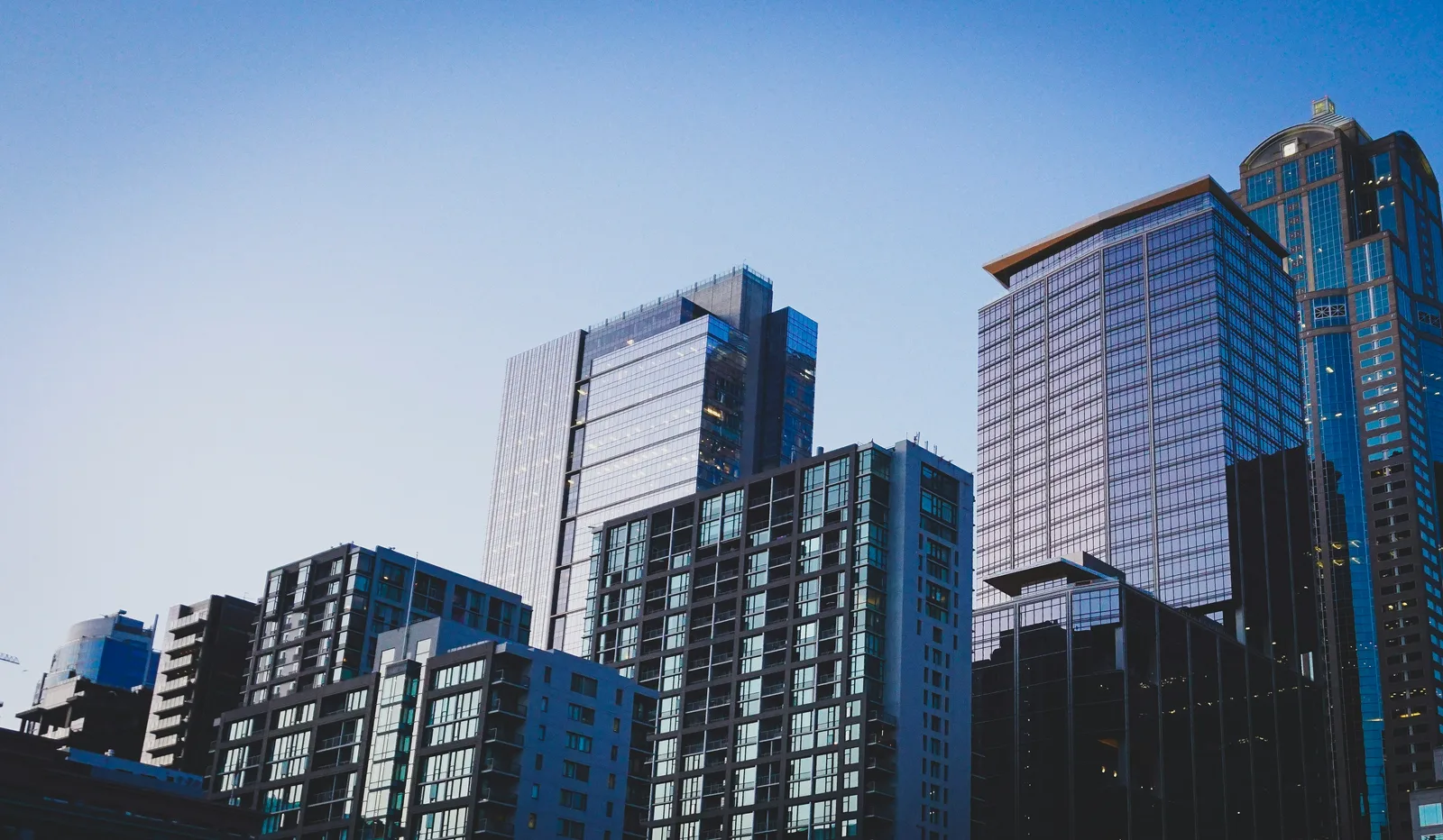 Modern city skyline representing the real estate impact on AI, highlighting how property data shapes generative engine optimisation, AI SEO pillars, and AI Visibility optimisation for brands aiming to recover traffic lost to AI.